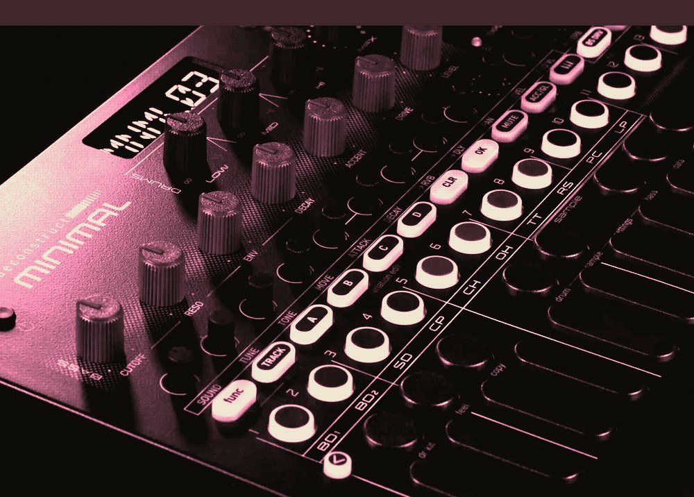 Angled view of the deconstruct MINIMAL control surface showing the function button, track button, A to B to C to D variation buttons and the illuminated step buttons